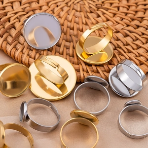 Close-up of adjustable stainless steel ring blanks in gold and silver for DIY jewelry