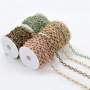 Detail of colorful enamel O-chain rolls in pink, black, blue, and white for DIY jewelry