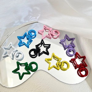 Colorful star-shaped metal keychains in various lacquer finishes for DIY bag accessories