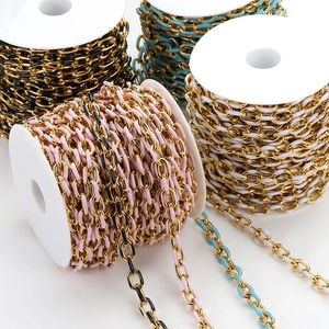 Detailed macro view of colorful enamel and gold-plated stainless steel link chains