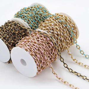 Detail of colorful enamel gold O-link chains on white spools for DIY jewelry making