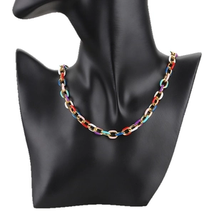 Colorful enamel oval link chain necklace in gold finish on black mannequin display