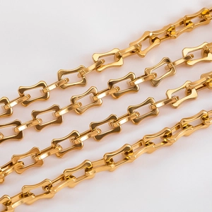 Macro shot of polished gold stainless steel wavy rectangular chain links for DIY jewelry