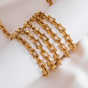 Detailed view of golden I-shaped chain links with polished finish for jewelry making