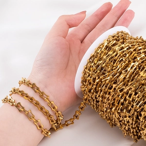 Detailed view of golden stainless steel bone chain links for DIY jewelry making