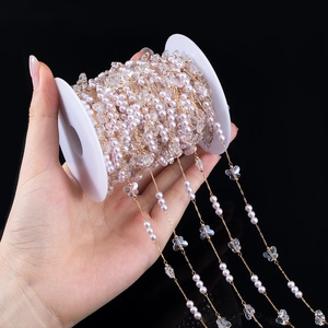 Detail of 4mm pink pearl and butterfly bead chain for DIY jewelry making