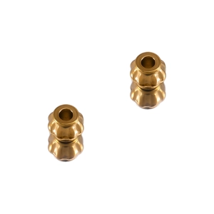 Macro detail of pumpkin shaped matte gold stainless steel spacer beads for DIY jewelry