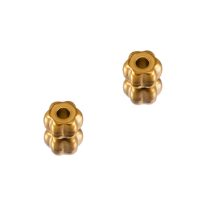Detailed macro view of matte gold pumpkin shaped flower beads with center holes
