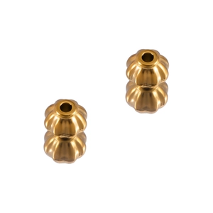 Detailed view of golden pumpkin-shaped stainless steel beads with a matte metallic finish