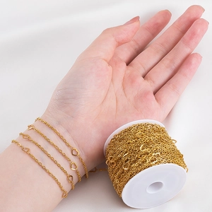 Golden stainless steel heart chain for DIY jewelry making wrapped around the wrist