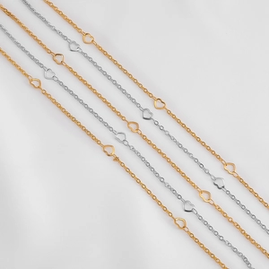 Detail of DIY stainless steel cross chains with hollow heart pendants in gold and silver
