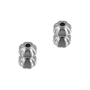 Macro detail of pumpkin shaped stainless steel spacer beads with vertical ribbed texture