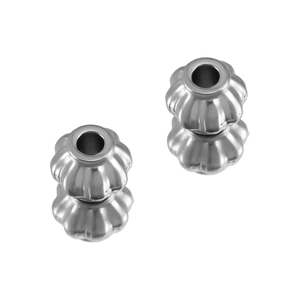 Macro detail of silver pumpkin-shaped stainless steel beads with vertical petal lines for DIY jewelry
