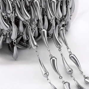 Macro shot of silver stainless steel fringe chain with teardrop pendants for DIY jewelry