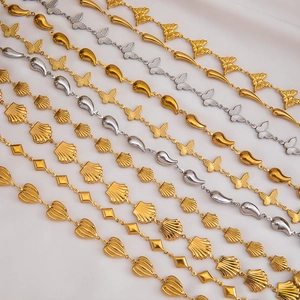 Detailed view of assorted stainless steel chains with butterfly and drop charms for DIY