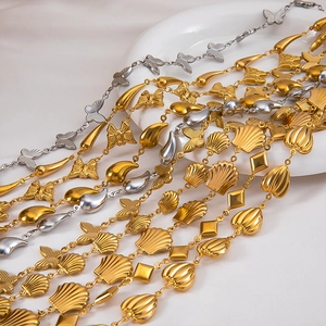 Detailed macro view of assorted butterfly and heart charms on stainless steel chains
