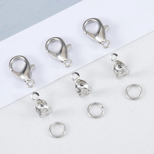 Detailed close-up of alloy lobster clasps and jump rings for DIY jewelry making