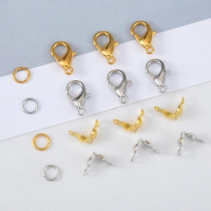 Macro view of gold and silver lobster clasps with jump rings for DIY jewelry making