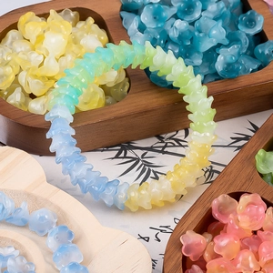 Macro shot of lily of the valley beads with frosted gradient colors for DIY jewelry making