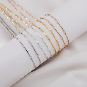 Minimalist copper chain necklace in gold silver and rose gold finishes on white stand