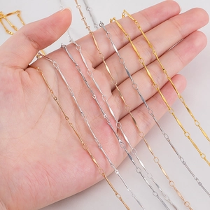Detailed view of slim copper bar link chains in gold, silver, and rose gold finishes