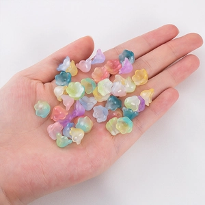 Macro shot of colorful gradient lily of the valley resin beads for DIY jewelry making