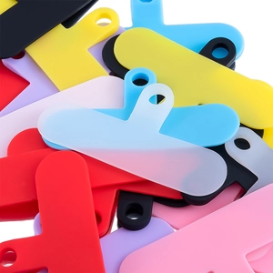 Macro shot of colorful universal phone lanyard connector pads with hanging holes