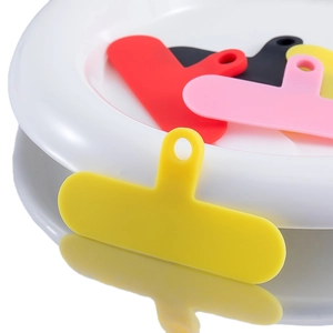 Universal colorful phone lanyard patches in yellow, red, pink, and black for phone cases