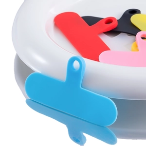 Macro shot of colorful universal phone case lanyard tabs with integrated hanging holes
