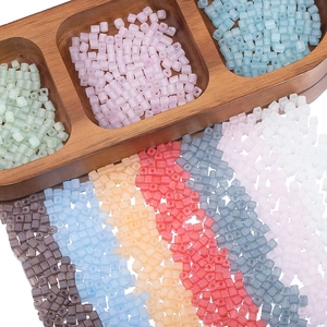 Macro shot of 4mm colorful matte glass cube beads for DIY jewelry and bracelet making