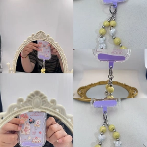 Clear phone case with purple border and colorful beaded crossbody strap featuring a yellow bear