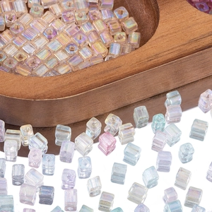 Macro shot of 4mm iridescent glass cube beads with central holes for DIY jewelry