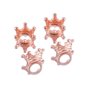 Detailed view of four rose gold crown jewelry charms for DIY handmade accessories
