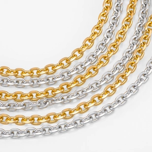 Close-up detail of polished gold and silver O-shaped aluminum chain links for DIY jewelry making
