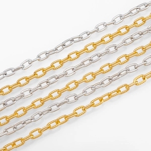 Detail of gold and silver aluminum jewelry chains with embossed cross patterns for DIY