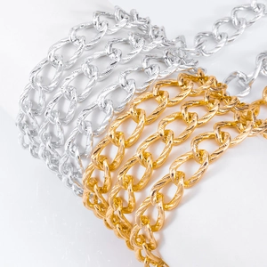 Macro detail of gold and silver twisted chain links for DIY jewelry and accessories