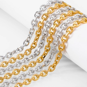 Detailed macro view of polished gold and silver cable chains for DIY jewelry making