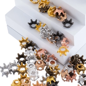 Macro detail of various metallic finish crown spacers for DIY jewelry making and crafts