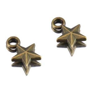Close-up of antique bronze star pendants with 3D faceted design for DIY jewelry making