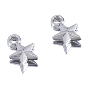 Macro shot of two silver 3D star-shaped pendants with metallic textures and top loops