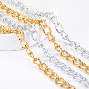 Close-up of gold and silver textured curb chains for DIY jewelry making and accessories