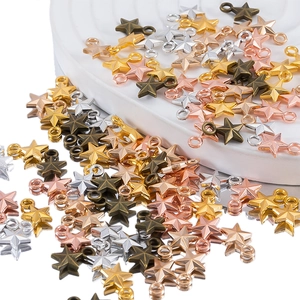 Macro detail of colorful 3D star-shaped metal pendants for DIY jewelry making
