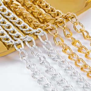 Macro shot of silver and gold twisted square curb chains for DIY jewelry crafts