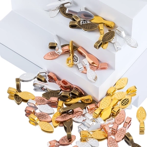 Detailed macro view of DIY vintage alloy shovel pendant clasps in four metallic finishes