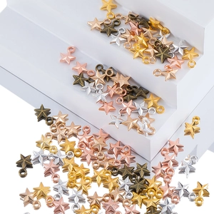 Detailed view of 3D star-shaped metal pendants in gold, silver, and copper for DIY jewelry