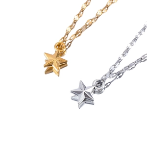 Golden and silver 3D star pendant necklaces with faceted design on white reflective base