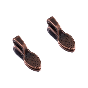 Detail view of retro copper alloy shovel charms for DIY jewelry making and pendants