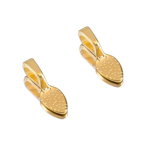 Detailed view of two gold alloy jewelry charms with dimpled texture and polished finish
