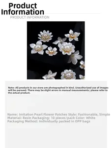 Macro detail of white resin shell pearl flower charms with rhinestones for DIY crafts