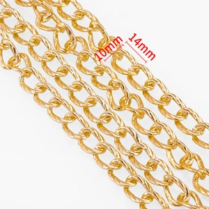 Macro shot of gold aluminum twist chain links for DIY jewelry, size 10mm by 14mm